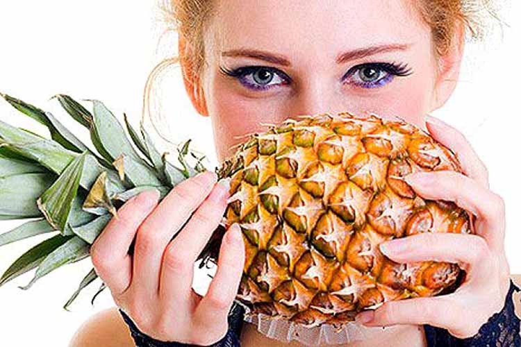 Close-up portrait of beautiful female with pineapple